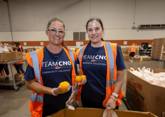 Two CNO associates volunteering