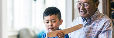 grandfather and grandson with toy airplane